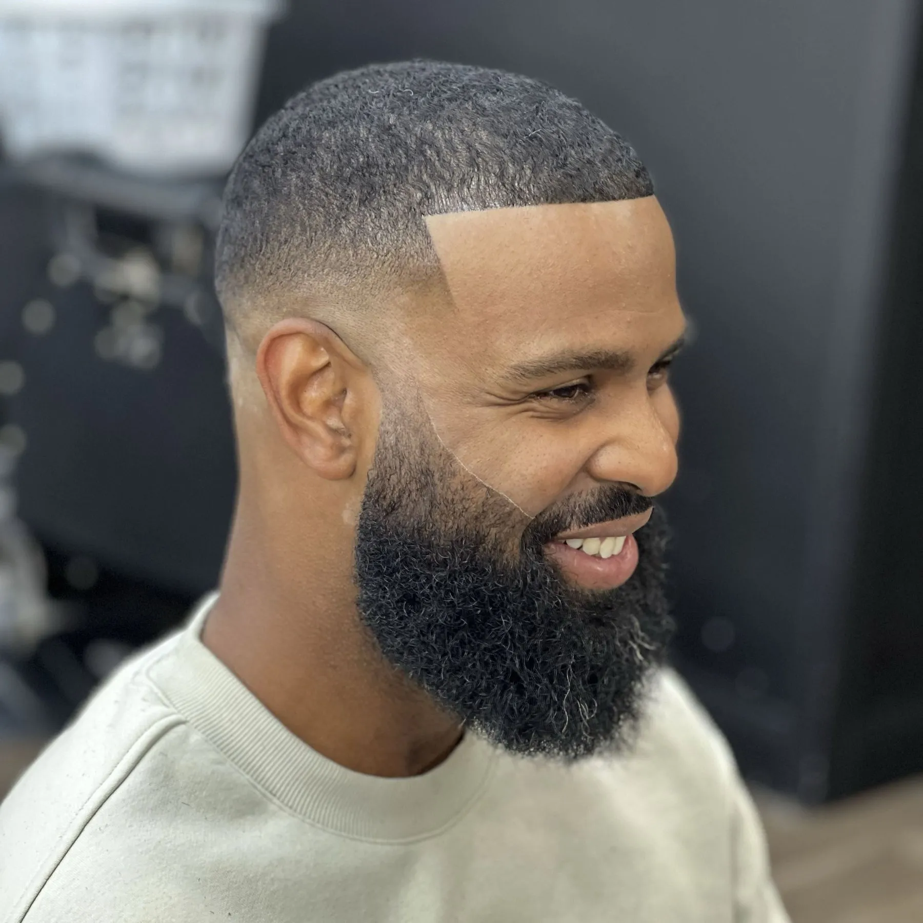Full beard shaped and lined up with a bald fade, by DomiBarberz